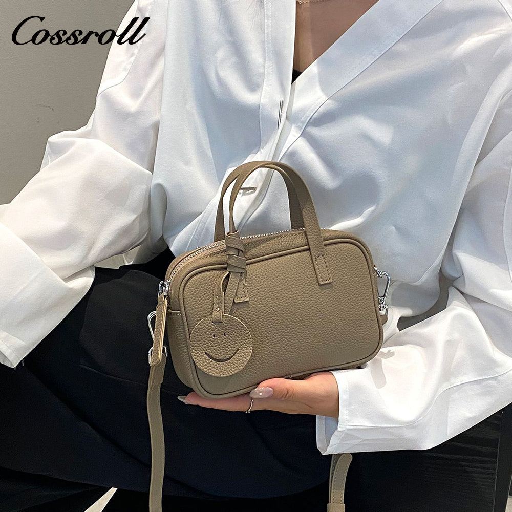 Head layer cowhide shoulder women's bag crossbody women's bag Europe and the United States fashion hundred practical soft leather round barrel apple bag leather