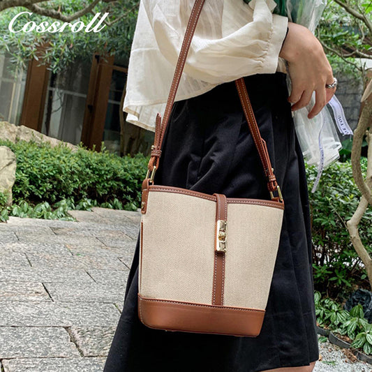 Cowhide canvas splicing bucket bag female 2024 summer single shoulder oblique cross bag leisure all-in-one underarm bag Korean version of the tide