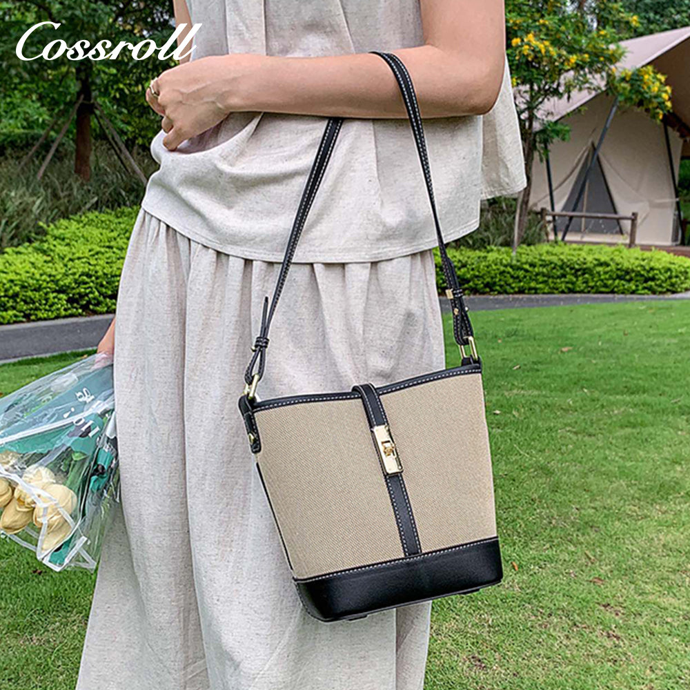 Cowhide canvas splicing bucket bag female 2024 summer single shoulder oblique cross bag leisure all-in-one underarm bag Korean version of the tide